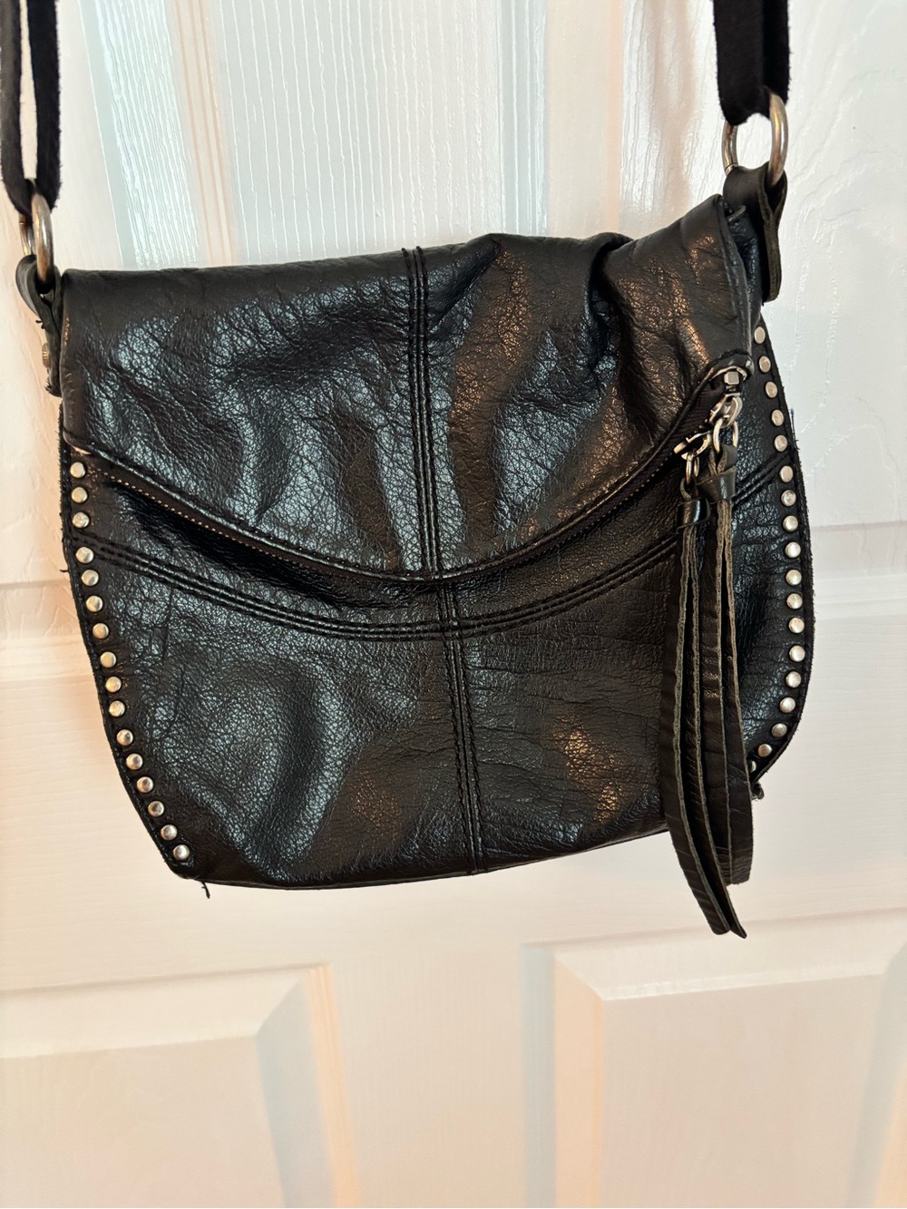The Sak Black Studded Leather Crossbody with Tassel Charm
